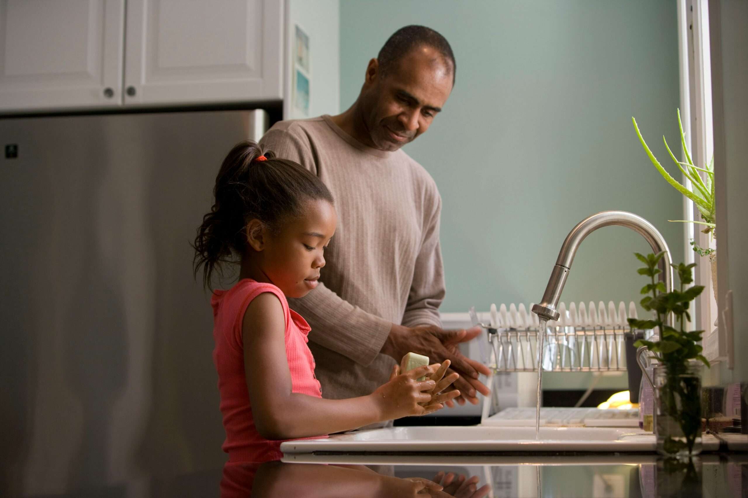 child washing hands